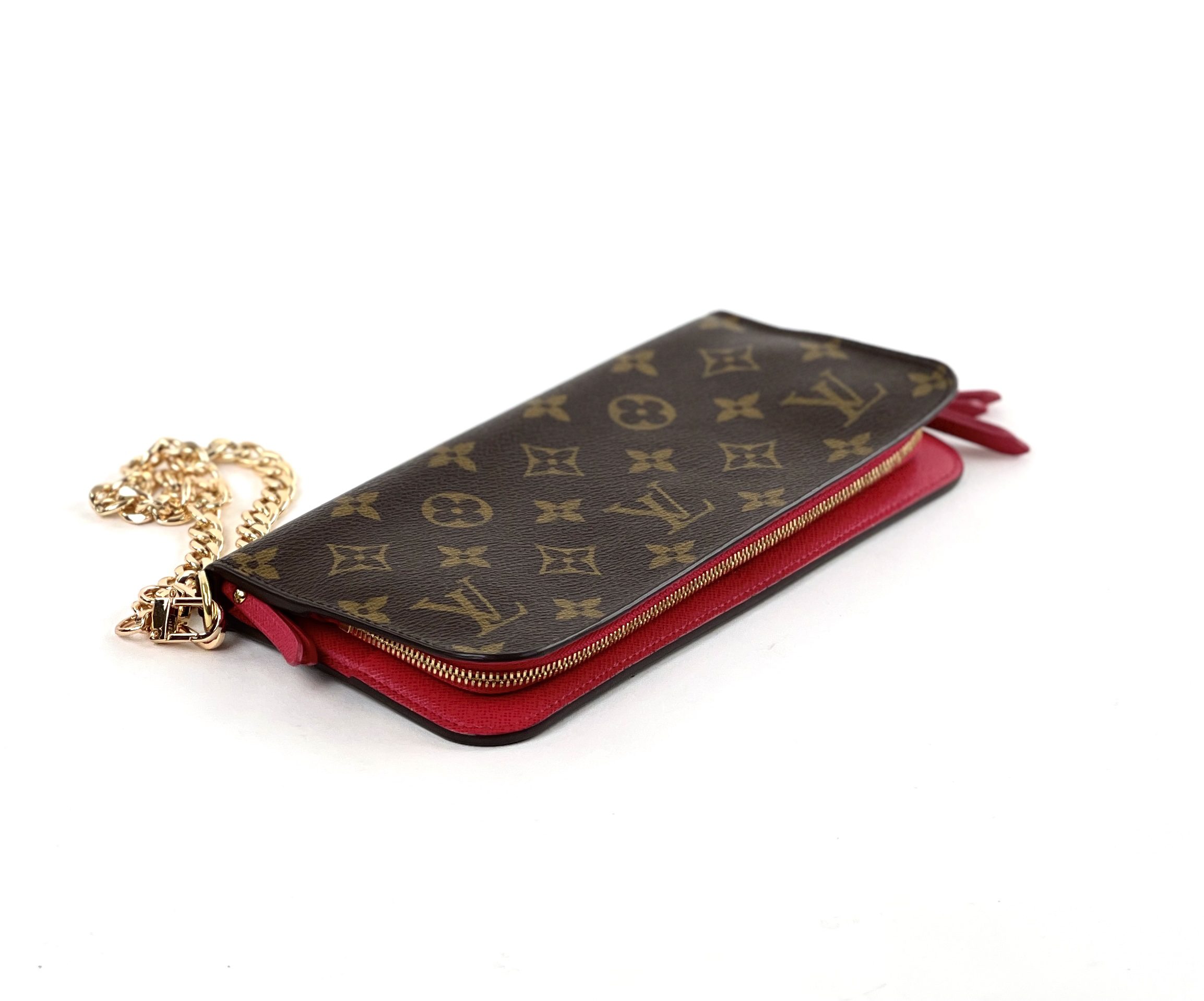 Louis Vuitton bright pink wristlet purse photographed on a white background  Stock Photo - Alamy