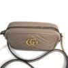 Angled view with the strap draped across the front
