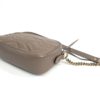 Side profile showing the slim depth of the camera bag
