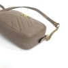 Angled view showing the chain and leather shoulder strap