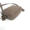 Angled view with the leather strap laid alongside