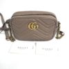 Marmont mini shown with its Gucci care and authenticity cards
