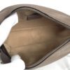 Interior held open showing the beige microfibre lining