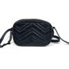 Front view standing upright with the strap raised