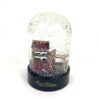 Angled view of the globe with snow settled at the base