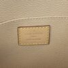 Louis Vuitton Paris tab inside the beige leather lining