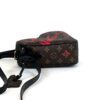 Side profile with the strap threaded through the loops