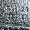 serial number embossed into the leather inside the bag