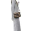 the bag worn crossbody on a dress form