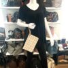 Pochette held by a mannequin in the boutique
