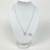 Pendant displayed on a white bust to show the drop