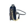 Clutch standing on its side with the chain strap