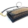 Angled view with the chain and leather strap