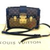 Clutch shown with its Louis Vuitton dust bag and strap