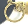Key ring attached to a navy leather bag strap
