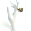 Ring displayed on a white hand at an angle