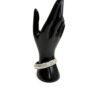 Display hand seen from a distance with the bangle on