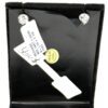 Earrings shown on the display card with their item tag
