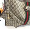 Side of the tote with the tiger head and pouch