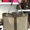Tote shown standing on the boutique shelf