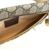 Pouch open showing the tan interior lining