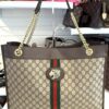 Tote standing with the chain handles upright