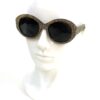 Angled view of the sunglasses on the display head