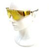 Sunglasses worn on a display head, seen in profile