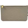 Front of the pouch showing the embossed monogram