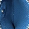 Card slot held open showing the blue leather inside