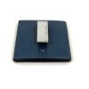 Angled view of the clip against the blue Epi leather