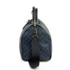 End view standing upright with the strap hanging