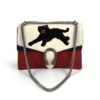 Front of the bag with the chain draped and panther embroidery