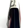 Side of the bag with the chain strap hanging