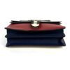Top view with the red flap closed over the blue base