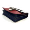 Angled view of the red flap over the blue body