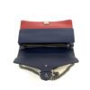 Top of the bag showing the blue and red leather panels