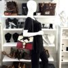 Mannequin wearing the bag with the chain on the shoulder
