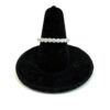Overhead angle of the band on the velvet display cone