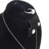 Close up of the ring and earrings on the velvet bust
