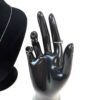 Display hand beside the necklace on its bust