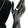 Ring on a display hand beside the necklace bust