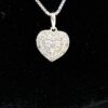 Close up of the pave heart pendant on its box chain