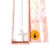 Necklace in its pink gift box with the ribbon