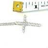 Cross measured against a tape to show the size