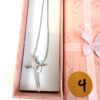 Gift box opened showing the necklace inside