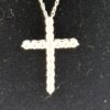 Close up of the cross showing the pave set sapphires