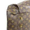 Low side view showing the gold stud and pleated canvas