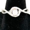 Close up of the round cluster in its pave halo