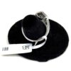 Ring laid over the display with the retail tag attached